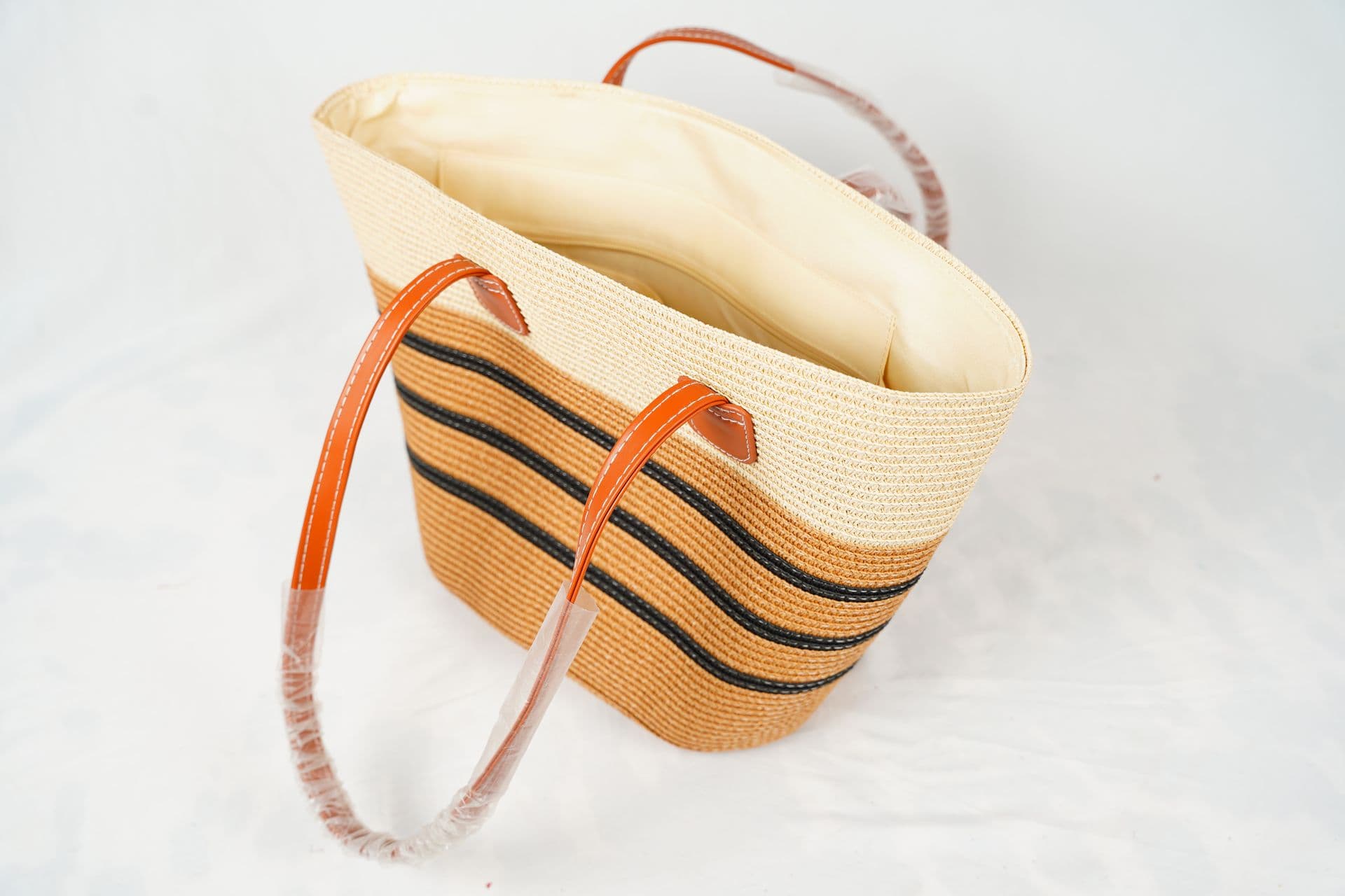 Tan basket with long handles
